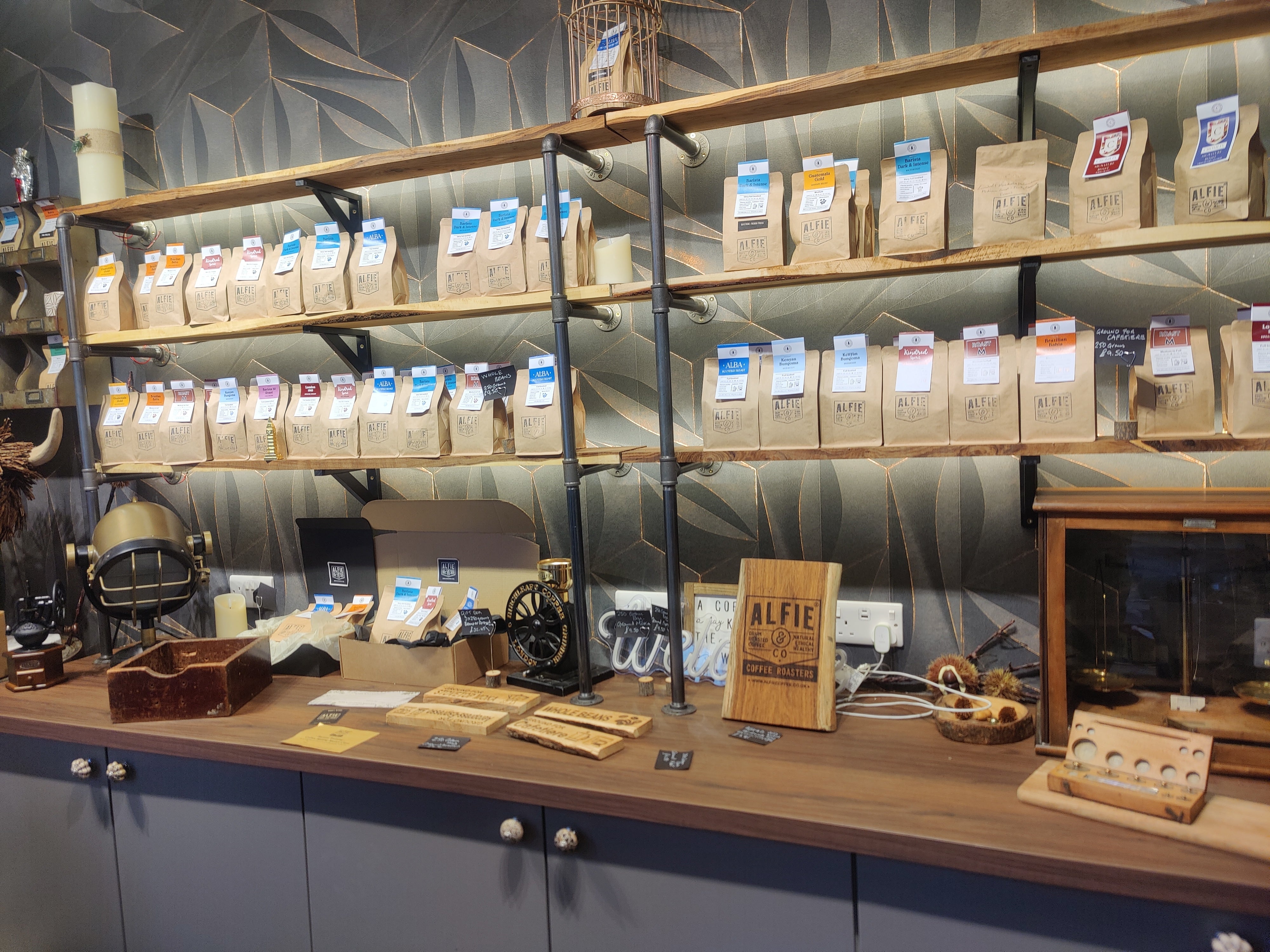 A well-lit, eye-level shot of the Alfie & Co Coffee feature wall.