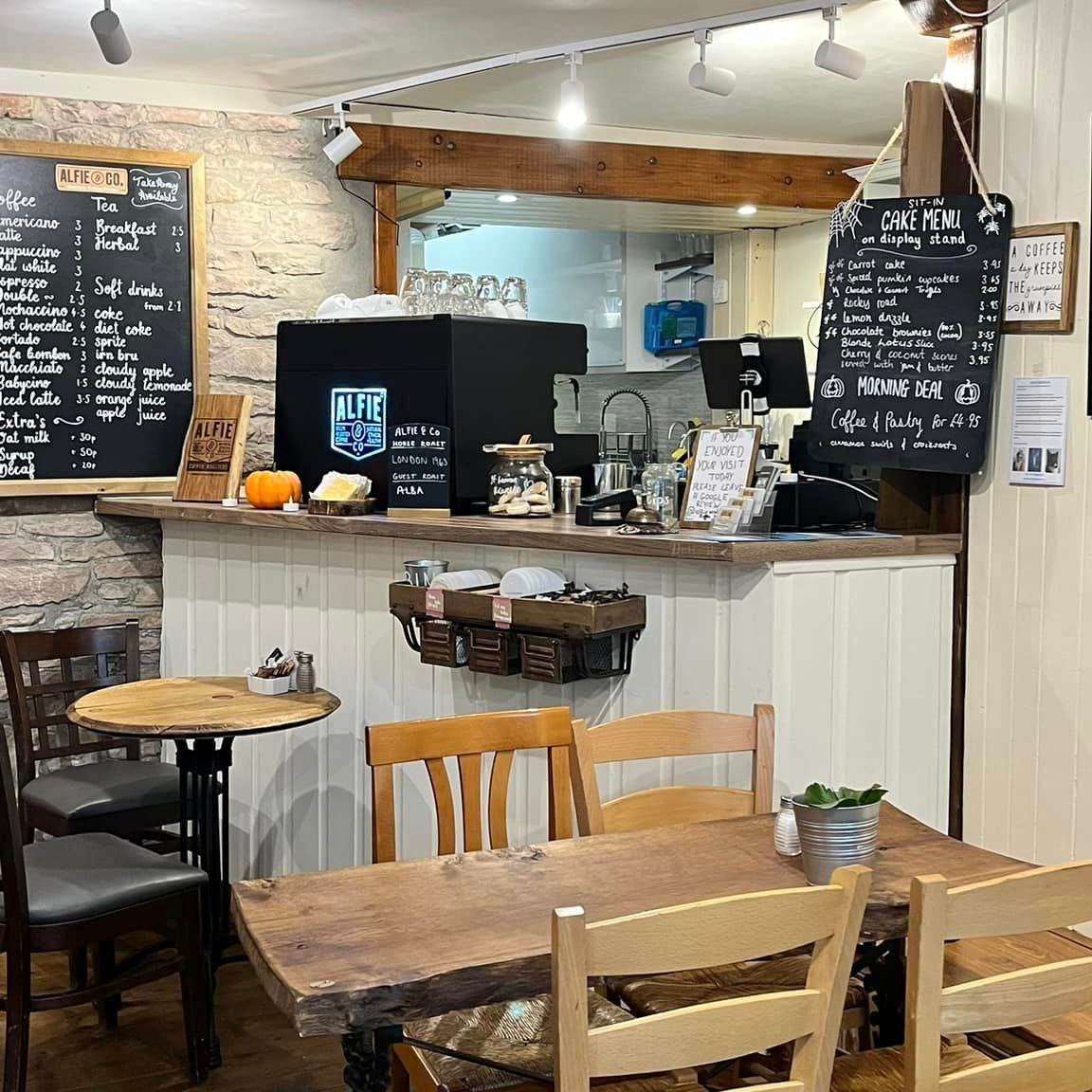 Picture of the shop counter of Alfie & Co Coffee Roasters cafe in Drymen. An internal picture of seating and the coffee counter.